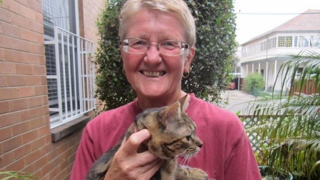 Kate Rowe pictured in recent times, holding a cat