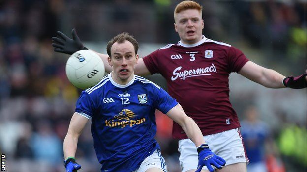Cavan's Martin Brady attempts to win the ball ahead of Galway's Sean Andy O'Ceallaigh at Salthill
