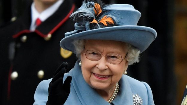 The Queen waving