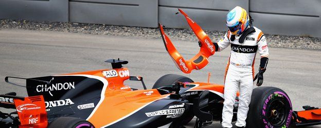 Fernando Alonso walks away after his car breaks down