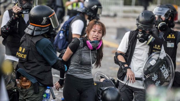 Police detain demonstrators in the Sha Tin district of Hong Kong on October 1, 2019