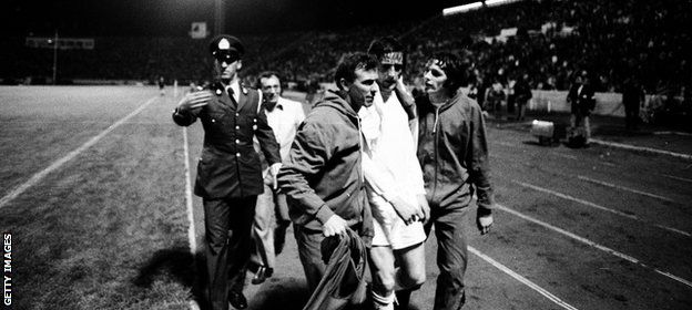 Hunter is led from the pitch after being sent off in a controversial European Cup Winners' Cup final defeat by AC Milan