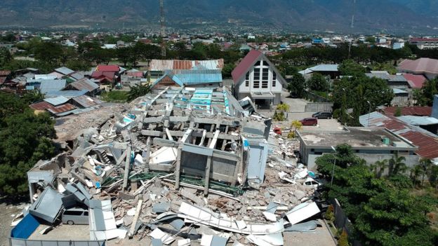 This aerial picture shows the remains of a ten-storey hotel in Palu in Indonesia