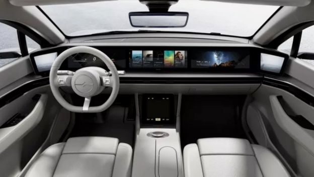 A panoramic dashboard visible inside the concept car