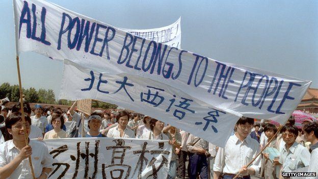 Waving banners, high school students march in Beijing streets near Tiananmen Square 25 May 1989 during a rally to support the pro-democracy protest against the Chinese government