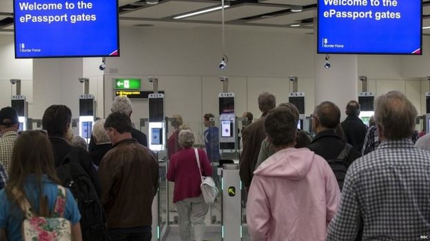 People waiting at passport control at Heathrow airport