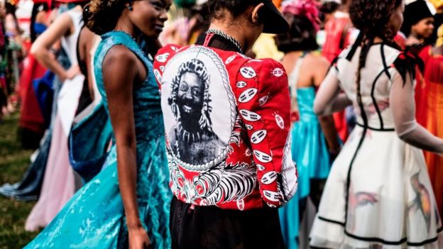 A model presents a creation by a local designer depicting a portrait of Zulu King Goodwill Zwelithini, during a fashion show at the 2017 Durban July horse race
