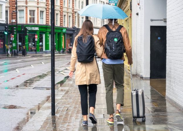Couple walking on a pavement in London