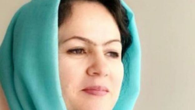 Koofi with a scarf covering her head but not her face