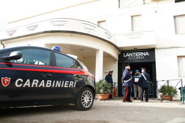 Carabinieri officers stand in front of the Lanterna Azzurra club in Corinaldo, near Ancona, Marche Region, central Italy, 8 December 2018
