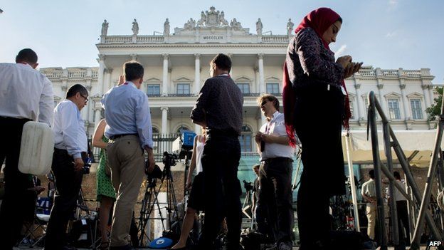 Journalists outside the Palais Coburg Hotel in Vienna where the talks are being held