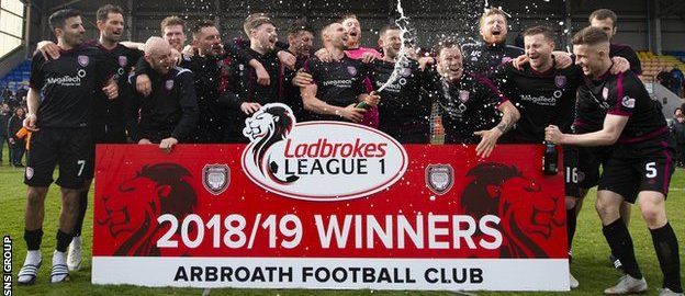 Arbroath players celebrate after clinching promotion