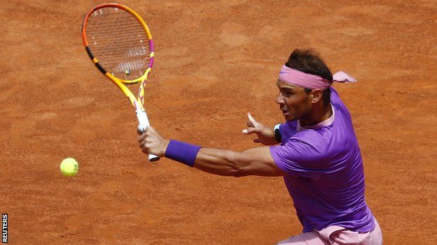 Rafael Nadal returns a ball against Alexander Zverev in their Italian Open quarter-final