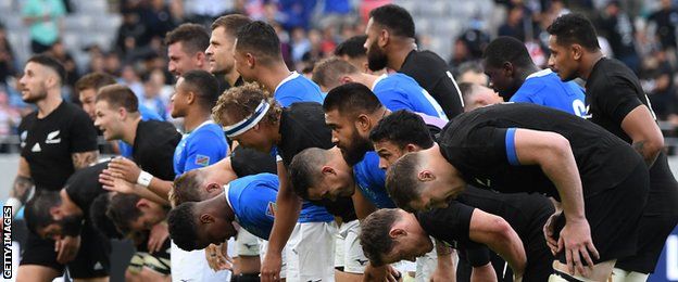 New Zealand and Namibia bow to the crowd at the end of the match