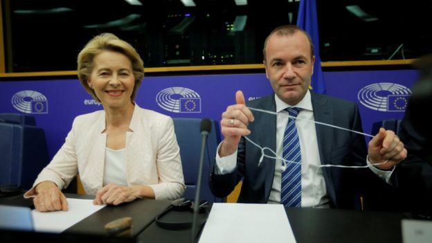 Ursula von der Leyen, who has been nominated as European Commission President, sits next to EU Parliament's political group European People's Party (EPP) president Manfred Weber at the European Parliament