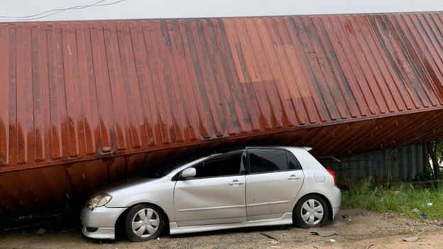 Car crushed by a container