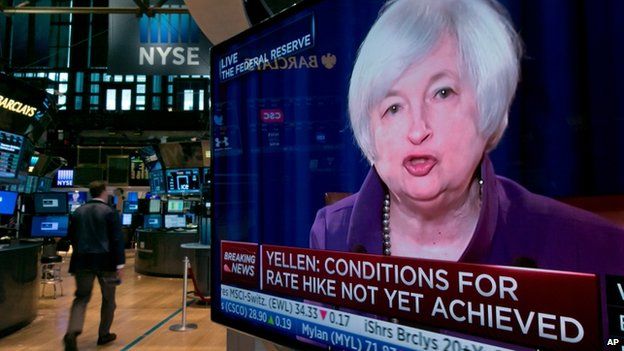 The press conference of Federal Reserve Chairperson Janet Yellen appears on a television screen on the floor of the New York Stock Exchange