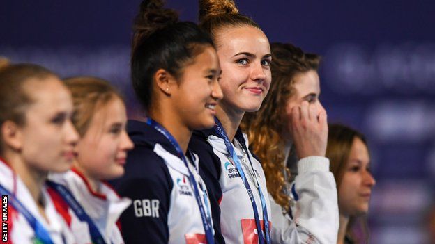 Lois Toulson smiles at her supporters on the podium as she collects her gold medal for winning the 10m synchronised final at the 2018 European Championships in Edinburgh