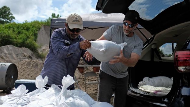 Residents load sandbags to protect their homes in Deltona, Florida, as they prepare for Hurricane Dorian, on August 31, 2019.