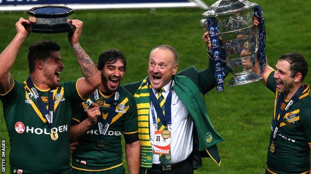 Tim Sheens celebrates Australia's World Cup success in 2013 with his players