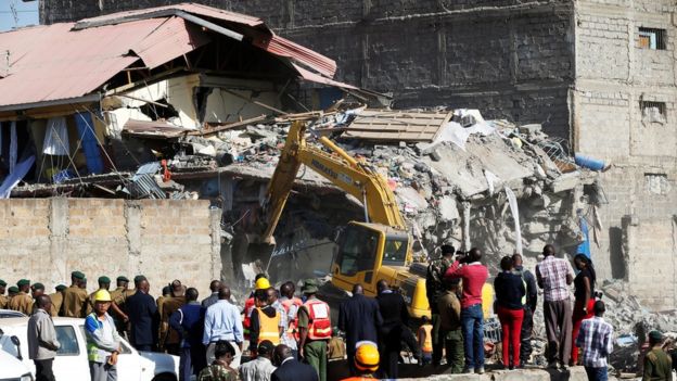 Rescue workers at the scene after a building collapsed in a residential area of Nairobi, 13 June 2017