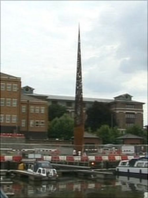 'Candle' statue alights in Gloucester Docks BBC News