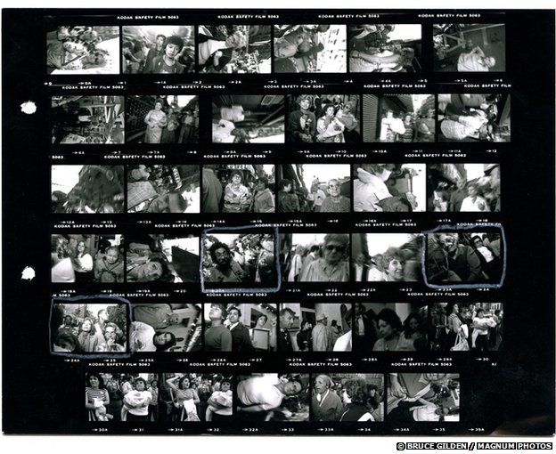 Bruce Gilden's contact sheet of pictures from the San Gennaro street festival in New York, 1984