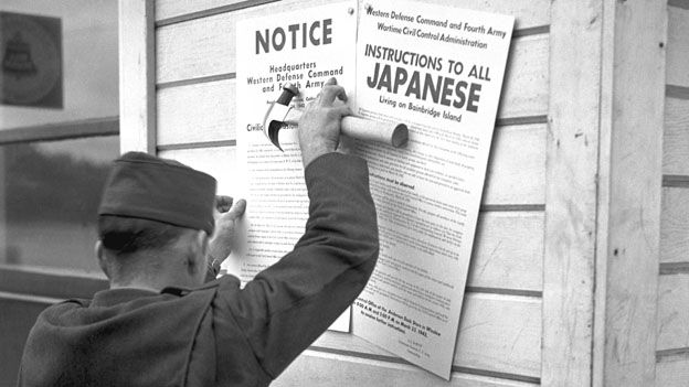 US soldier posting a Civilian Exclusion Order for Japanese-Americans. Photo courtesy of the Museum of History and Industry