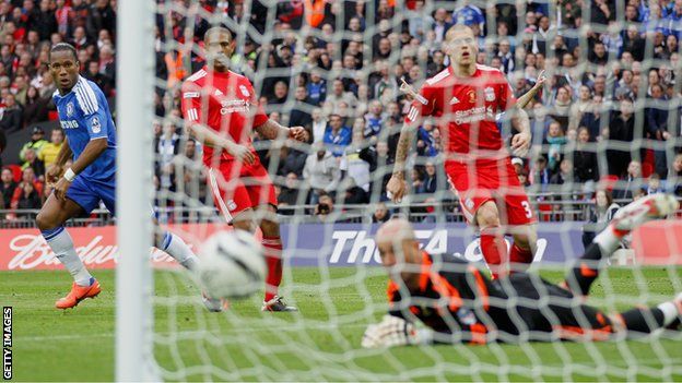 Chelsea striker Didier Drogba scores against Liverpool in the FA Cup final
