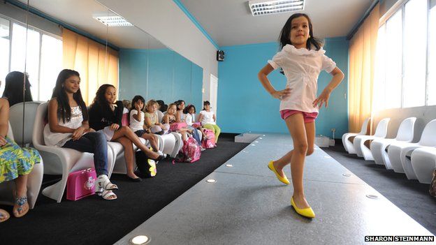 Young girl on the catwalk at Giselle's beauty school