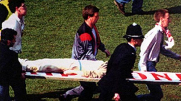 Kevin being carried on a stretcher (Image from Anne Williams)