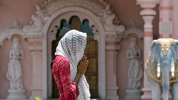 Hindu worshipper prays at a temple in Trinidad and Tobago