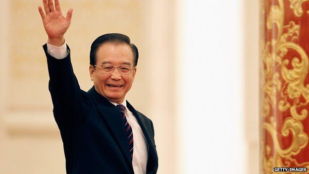 Wen Jiabao waves as he arrives for a news conference following the close of China's National People's Congress (NPC) at The Great Hall Of The People in Beijing, 14 Mar 2012