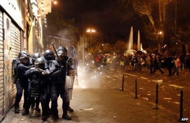 Violent clashes as austerity protests grip EU cities - BBC News