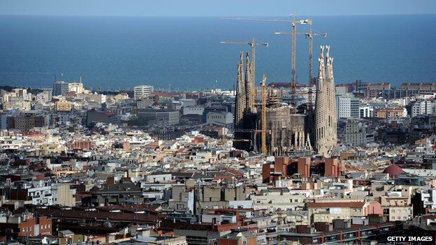 View across Barcelona towards Antoni Gaudi's unfinished La Sagrada Familia cathedral