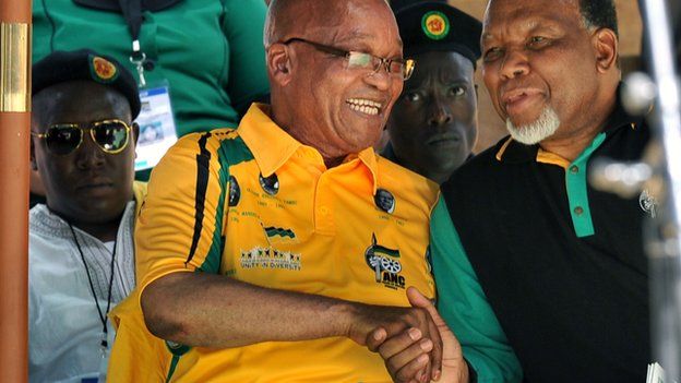 President Jacob Zuma (in yellow) shakes hands with his deputy Kgalema Motlanthe with expelled ANC Youth League leader Julius Malema wearing sunglasses behind