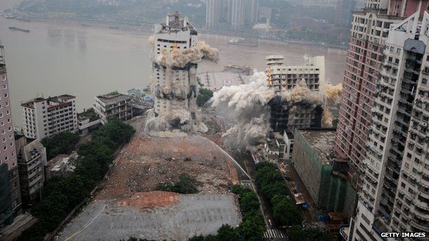 The Three Gorges Hotel and a passenger terminal are imploded in Chongqing, China