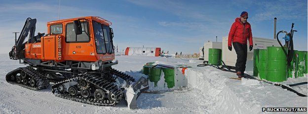Clearing snow from the fuel drums