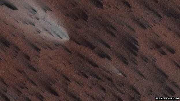 Image of Martian surface showing fan-shaped deposits