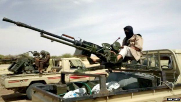 A handout photo of a video grab provided by the SITE Monitoring Service on 10 January 2013 and posted on 9 January on jihadist forums by a group calling itself al-Sahara Media Foundation reportedly shows al-Qaeda in the Islamic Maghreb fighters preparing for war in northern Mali