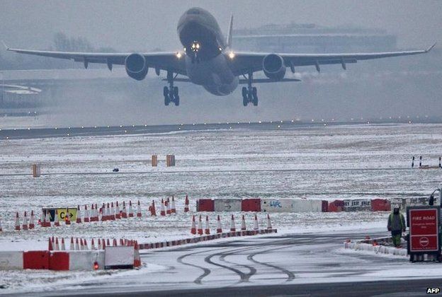 Plane takes off from Heathrow airport on 21 January 2013