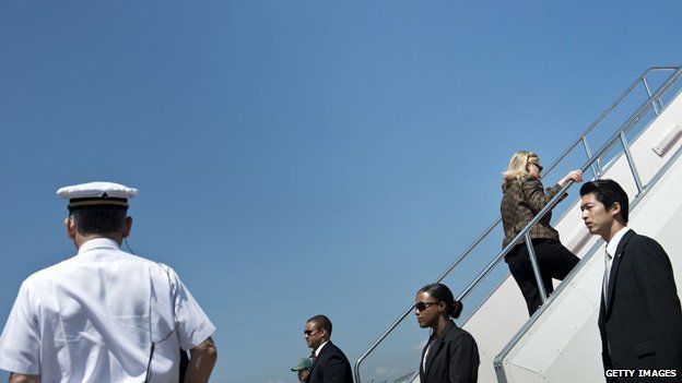 Hillary Clinton boards a plane