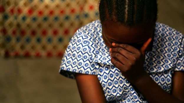 DR Congo rape victim talking to health worker