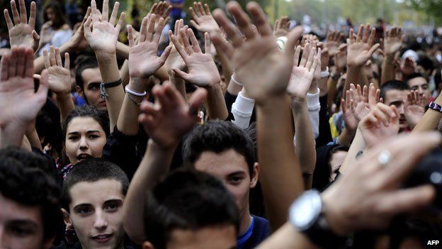 Young people raising hands