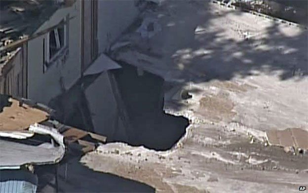 The sinkhole revealed as the house is demolished
