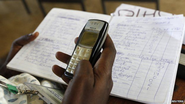 An electoral agent tallying votes in Kisumu, Kenya, on 5 March 2013