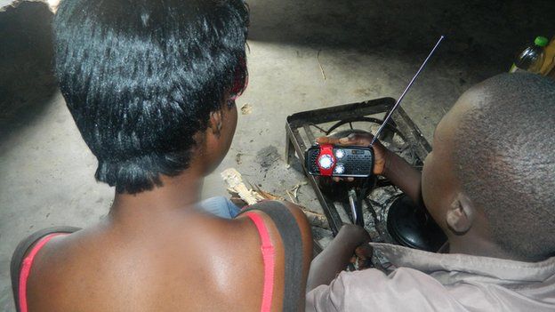 People listening to a radio in Zimbabwe
