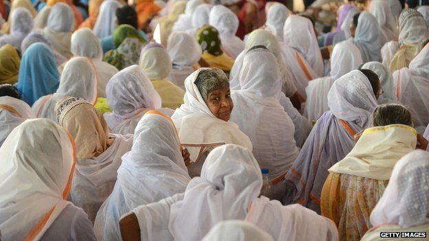 Indian widows from Vrindavan, the northern state of Uttar Pradesh, listen to speakers during a function in Delhi on September 27, 2012