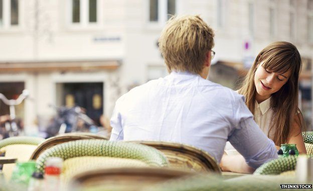 Man and woman sitting at table