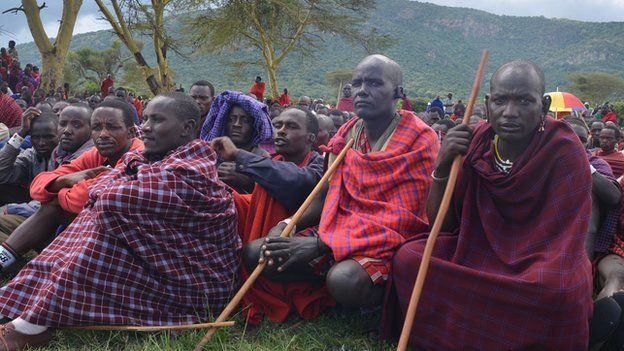 Maasai men listen to speakers at the protest in the shadow of Mt Olorien